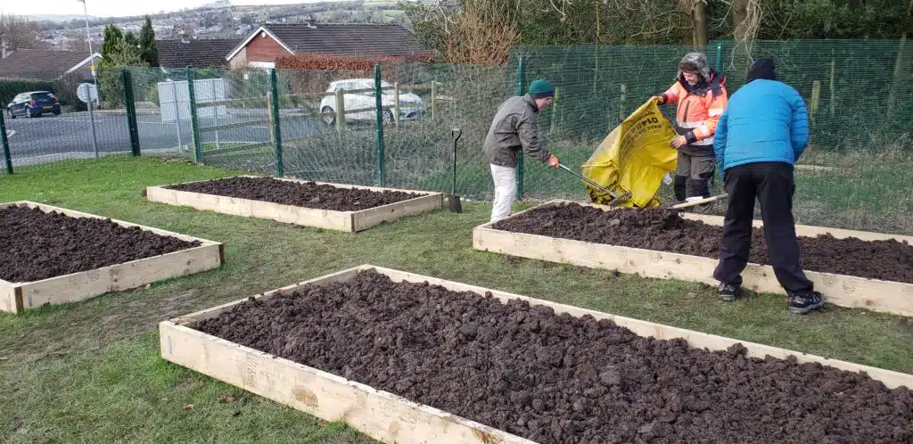people workig on raised beds