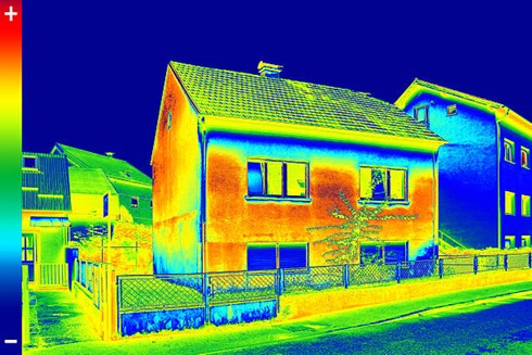 Thermal image of heat loss from house